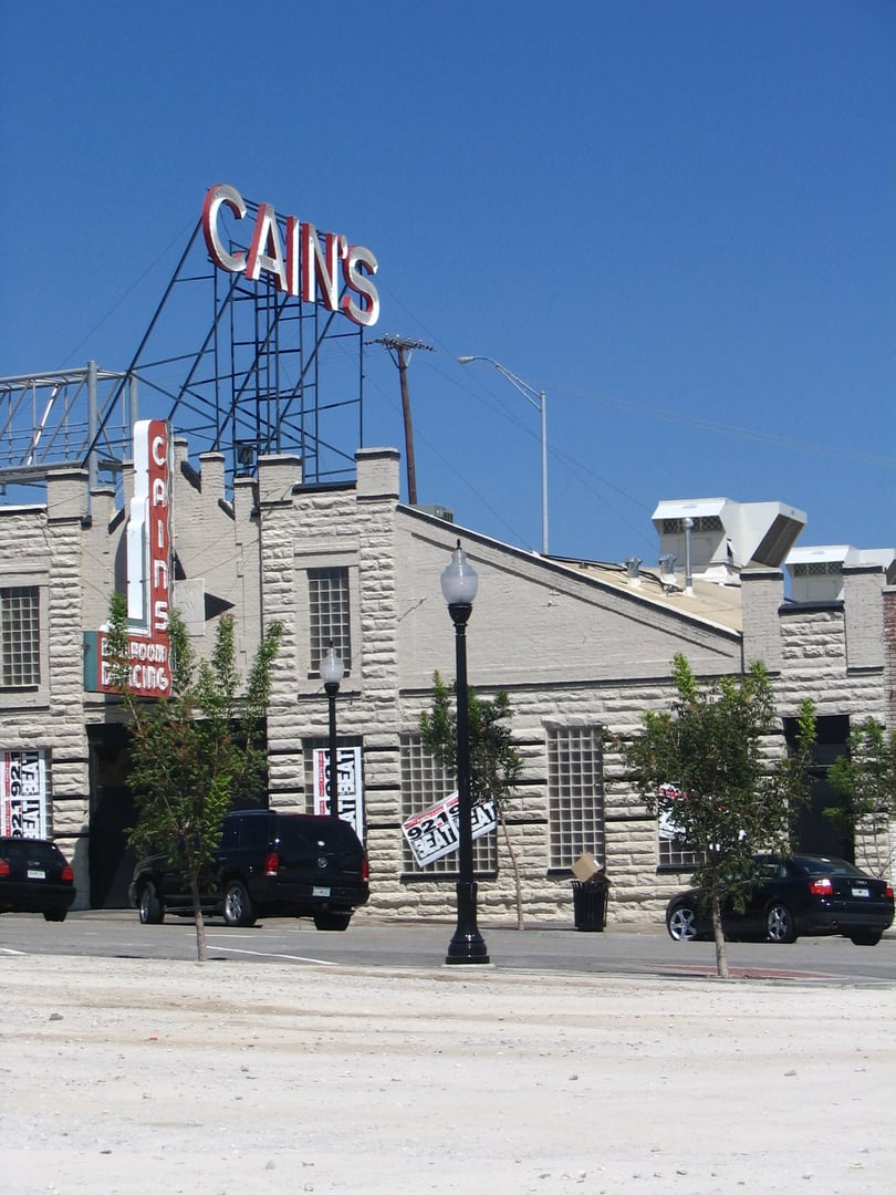 Exterior of Cain's Ballroom on N Main Street in Tulsa, Oklahoma, the 1924 brick western swing dance hall with neon signage.