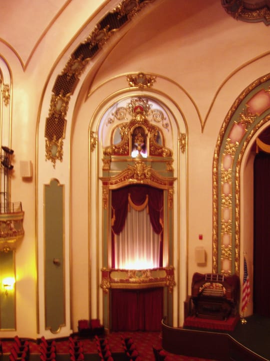 An ornate gilded archway and box beside the stage inside the Coleman Theatre, Miami, Oklahoma.