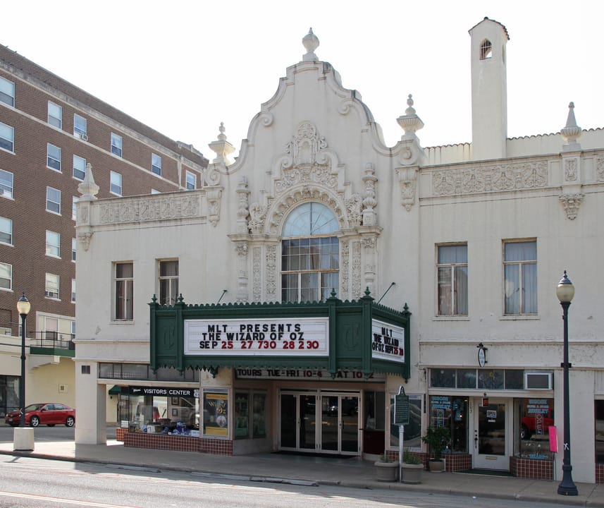 The Coleman Theatre's frontal facade and marquee on Main Street, Miami, Oklahoma, advertising a community theatre production of The Wizard of Oz.