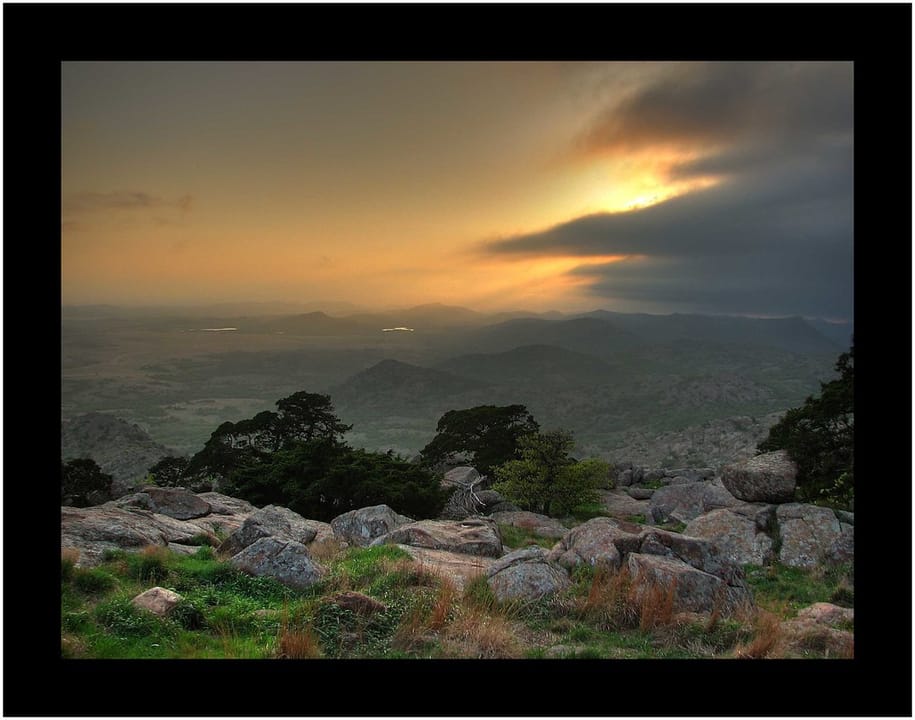 This was a nice opportunity as a storm moved across Mt. Scott in the Wichita Mountains, Oklahoma.That is &quot;Mt. Scott's Boy&quot; in the foreground.  Mt. Sheridan is in the distance.You can see the propinquity of Lake Jed Johnson and Rush Lake from the reflecitions.

Be sure to click on the image