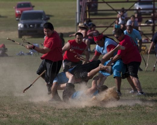 Two teams playing at the Kullihoma Stickball Tournament in Oklahoma.