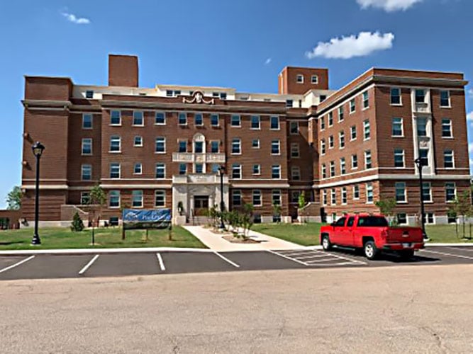 Exterior of the restored five-story former Logan County Memorial Hospital building, now the Villas of Benedictine Pointe senior apartments, at 2000 W Warner Ave, Guthrie, Oklahoma