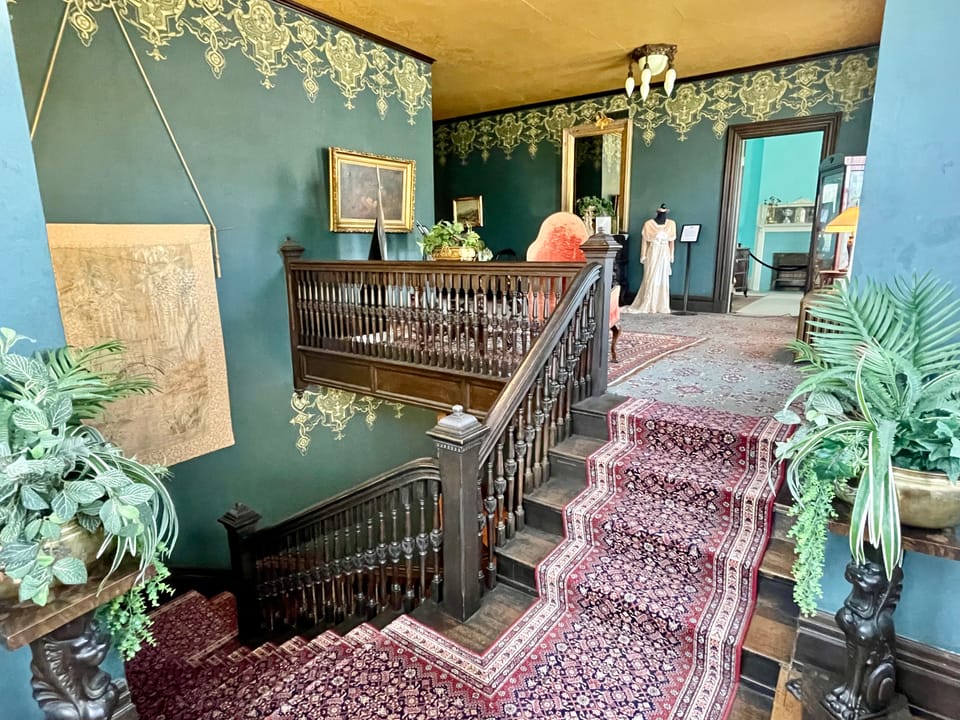 The main staircase landing and stained glass inside the Overholser Mansion, Oklahoma City, 2022.