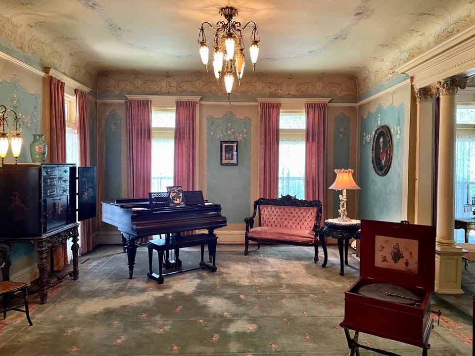 The music room, with grand piano, inside the Overholser Mansion, Oklahoma City, 2022.
