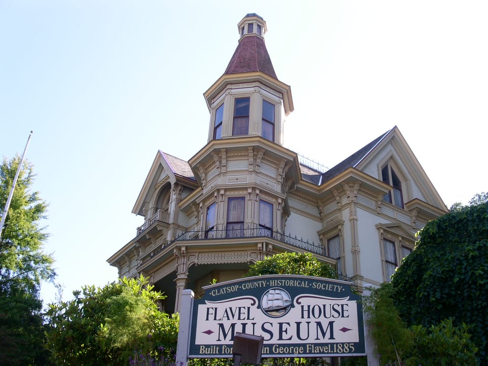 The Captain George Flavel House Museum, with the Clatsop County Historical Society's entrance sign on the lawn