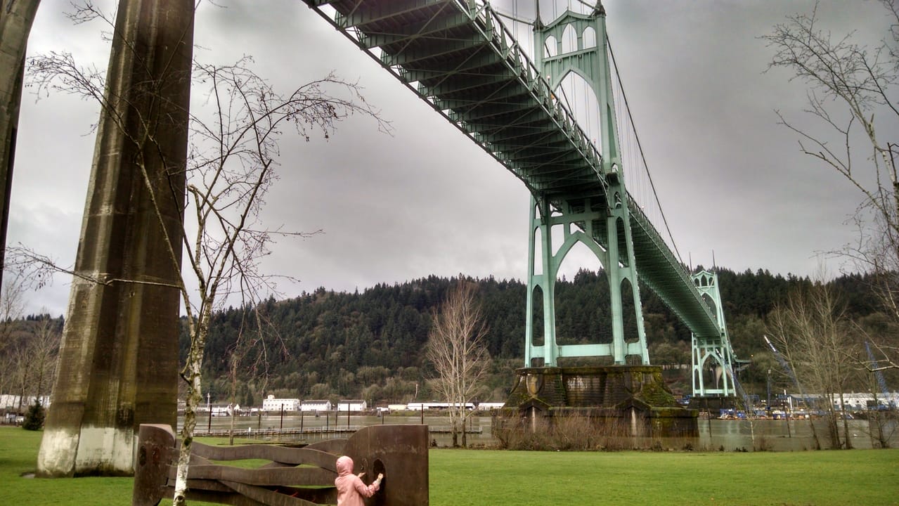Permanent outdoor exhibit of a metal river at Cathedral Park, under the St. John's Bridge in Portland Oregon, installed with music box tune of Hoagy Carmichael's "Up A Lazy River", the year the bridge was built.