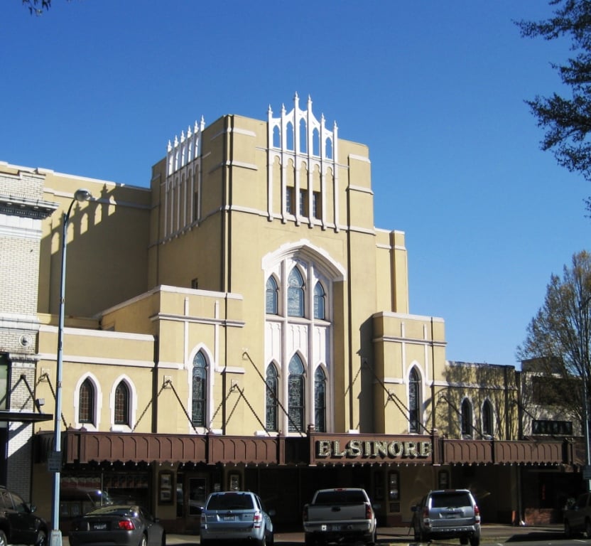 Tudor Gothic facade of the Elsinore Theatre (1926) on High Street SE in downtown Salem, Oregon, with crenelated towers and pointed arches