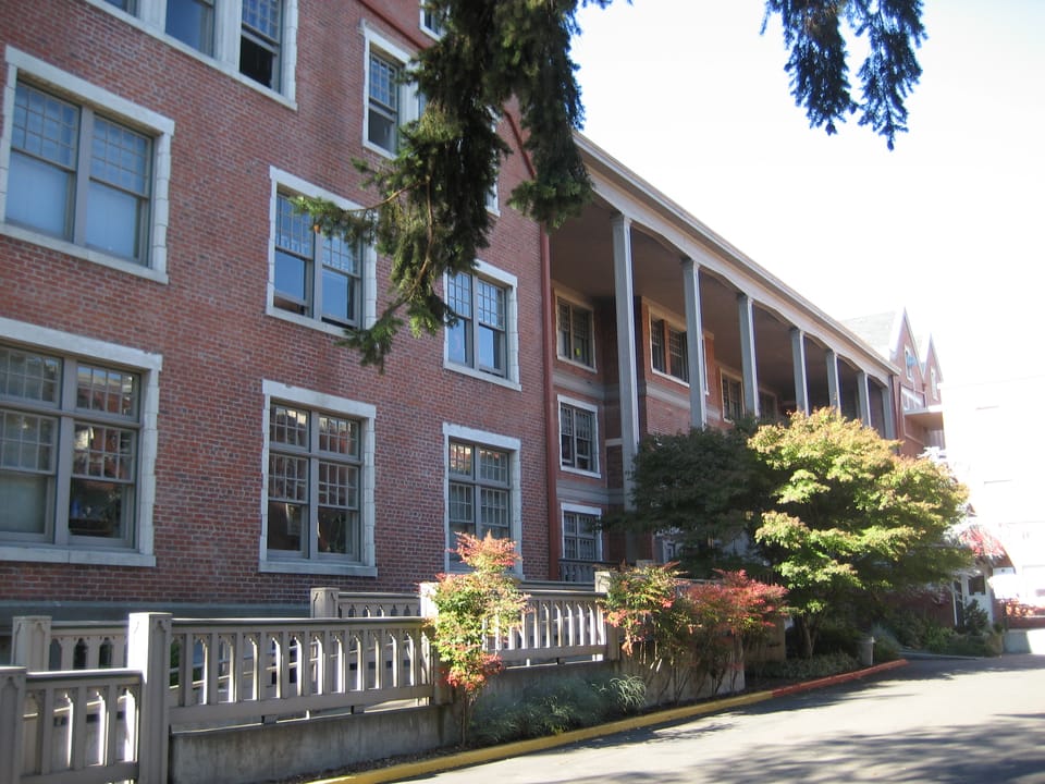 Lausanne Hall, the 1920 brick dormitory on the Willamette University campus in Salem, Oregon, viewed from the front and north side