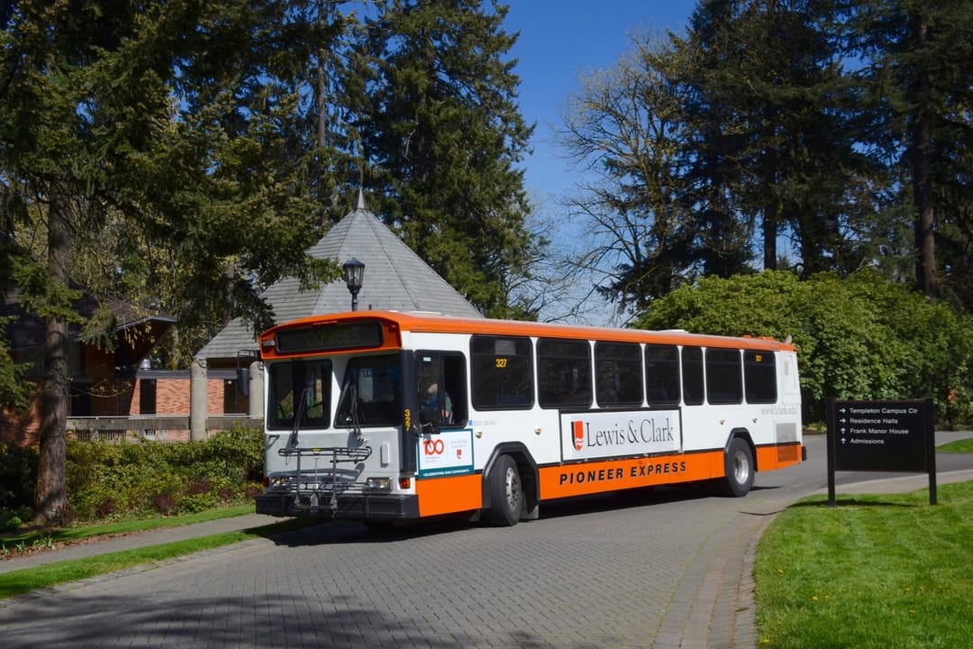 Pioneer Express bus 327 turning onto Frank Manor Drive, on the campus of Lewis &amp; Clark College, at the beginning of a trip to downtown Portland, Oregon. Bus 327 is a 1996 Gillig Phantom diesel bus, ex-King County Metro (Seattle) 3276.  It was acquired secondhand in 2014 by ECOShuttle, which prov