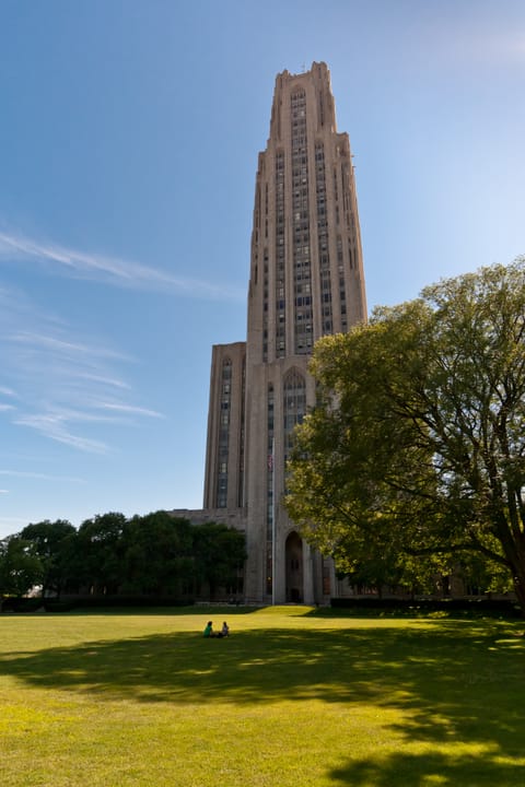 University of Pittsburgh Cathedral of Learning Gothic Revival skyscraper at dusk
