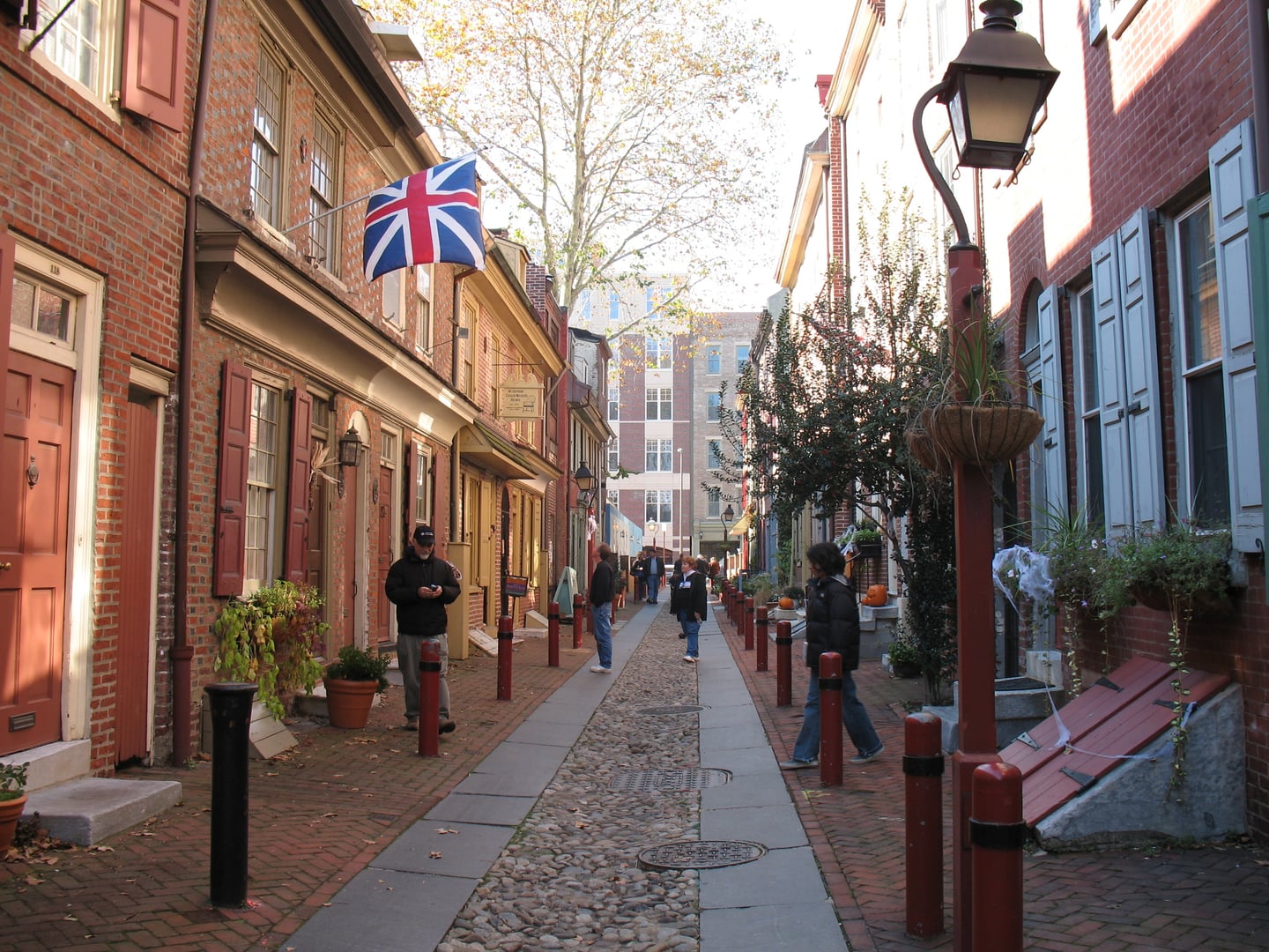 Cobblestoned Elfreth's Alley in Philadelphia's Old City, lined with 18th-century brick row houses