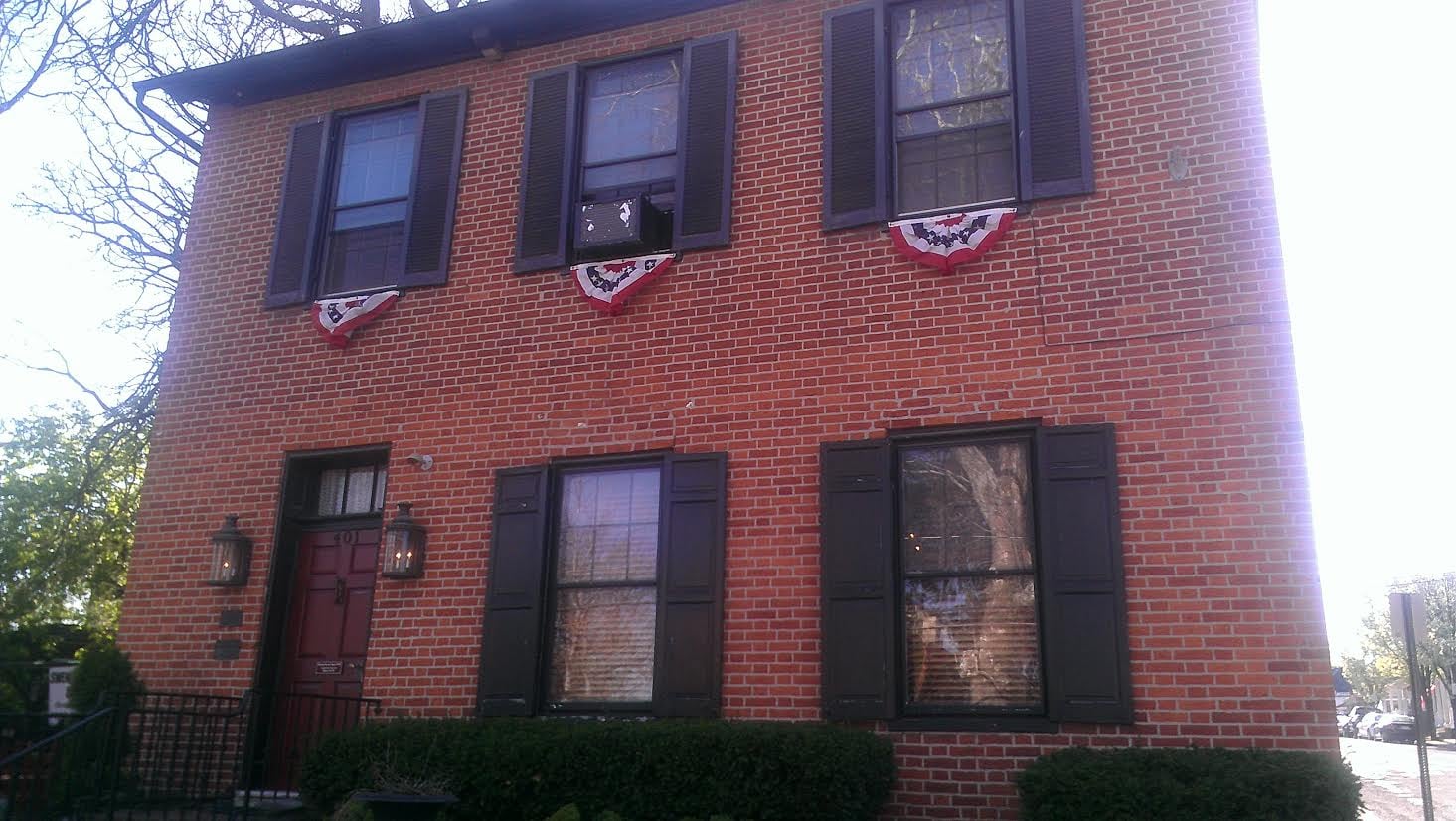 Brick south wall pocked with Civil War-era bullet holes at the Farnsworth House Inn in Gettysburg, Pennsylvania
