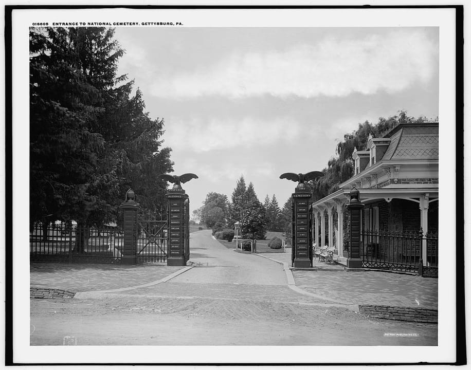 The wrought-iron entrance gate to Soldiers' National Cemetery at Gettysburg, photographed by the Detroit Publishing Company around 1900-1906; the gate's own embossed caption reads "Entrance to National Cemetery, Gettysburg, Pa."