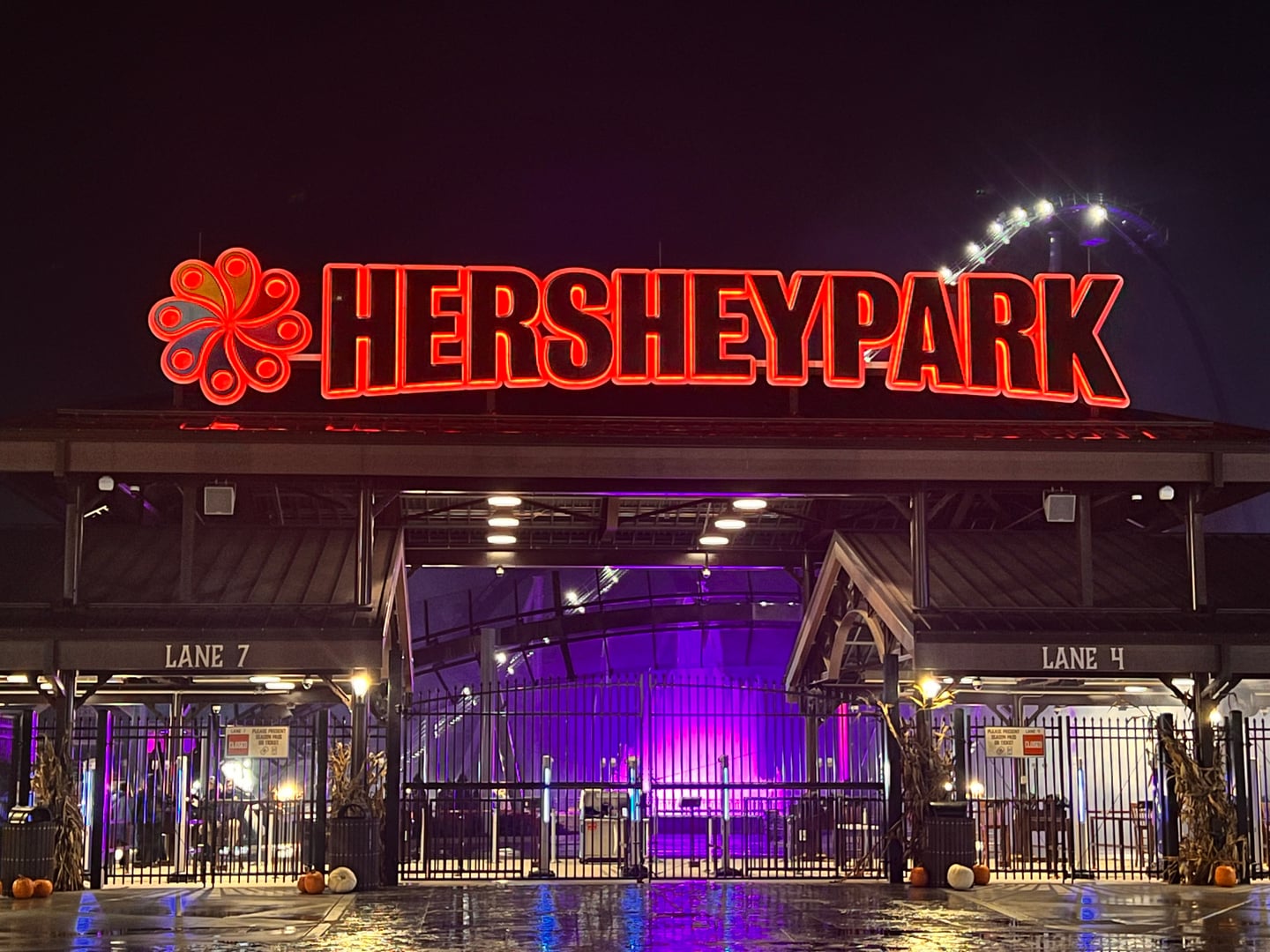 Hersheypark main entrance lit at night, the theme park founded by Milton Hershey in 1906 in Hershey, Pennsylvania