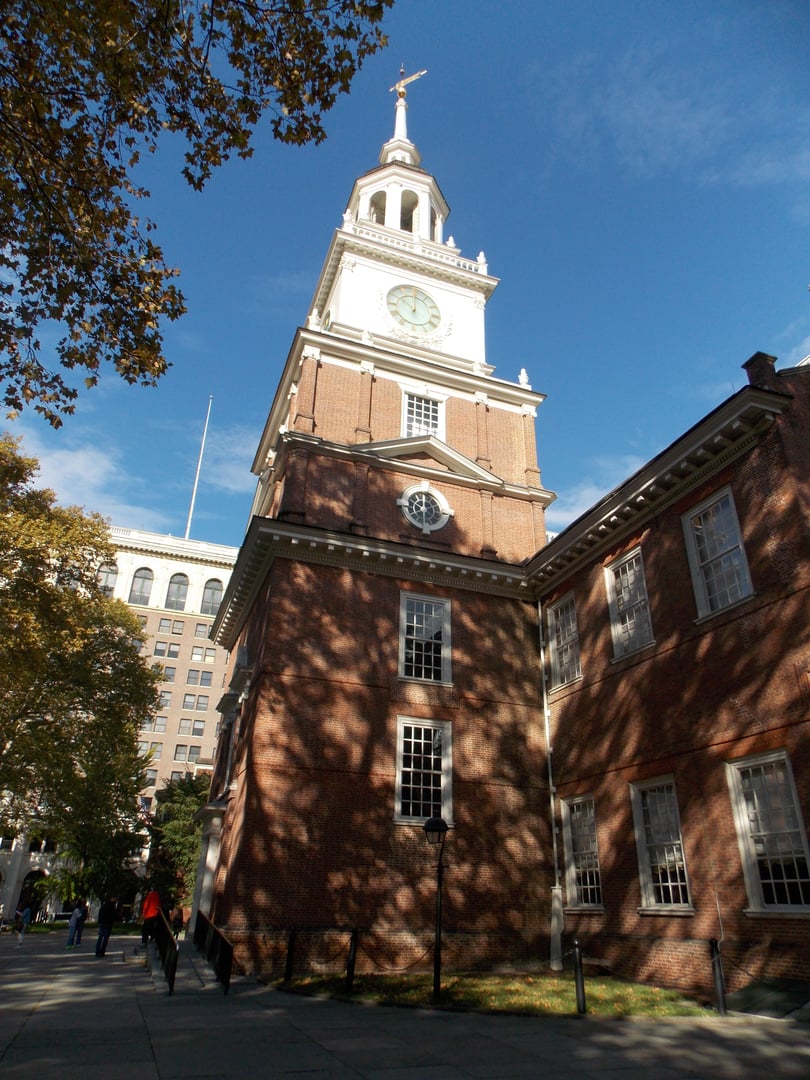 Brick Georgian facade of Independence Hall with central clock tower in Philadelphia