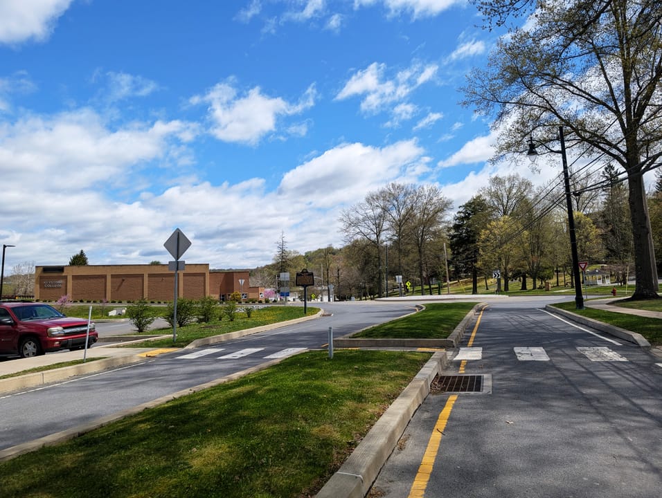 Photo of southbound College Avenue in Factoryville, Pennsylvania on the campus of Keystone College. Photo taken looking east-southeast between Regina Way Street and Edwards Lane.