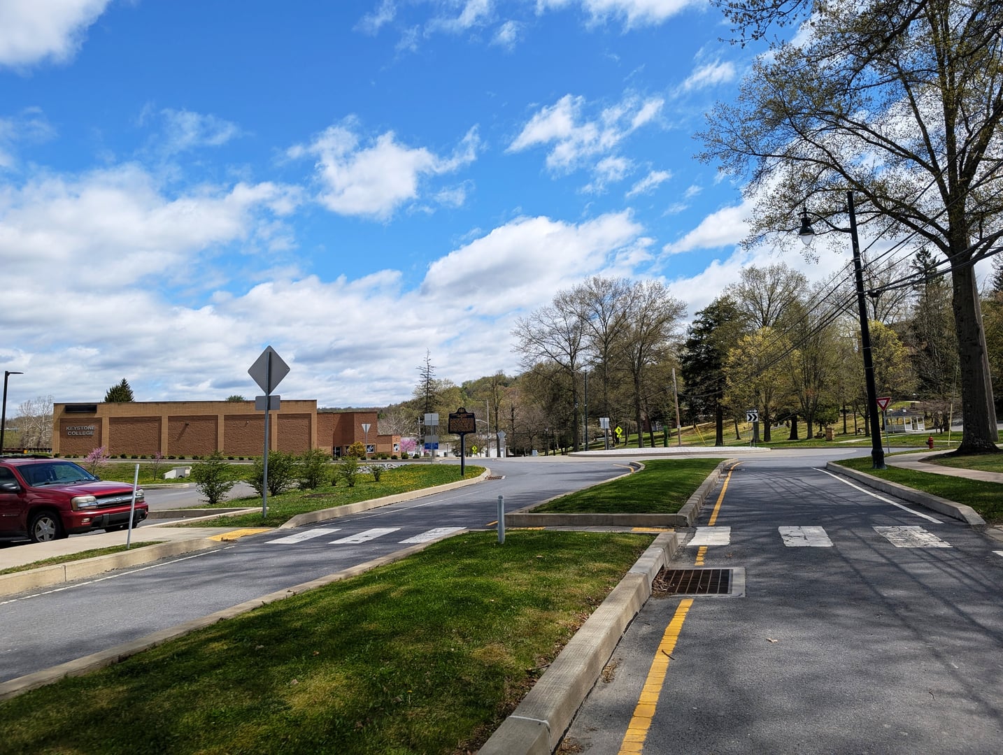 Photo of southbound College Avenue in Factoryville, Pennsylvania on the campus of Keystone College. Photo taken looking east-southeast between Regina Way Street and Edwards Lane.