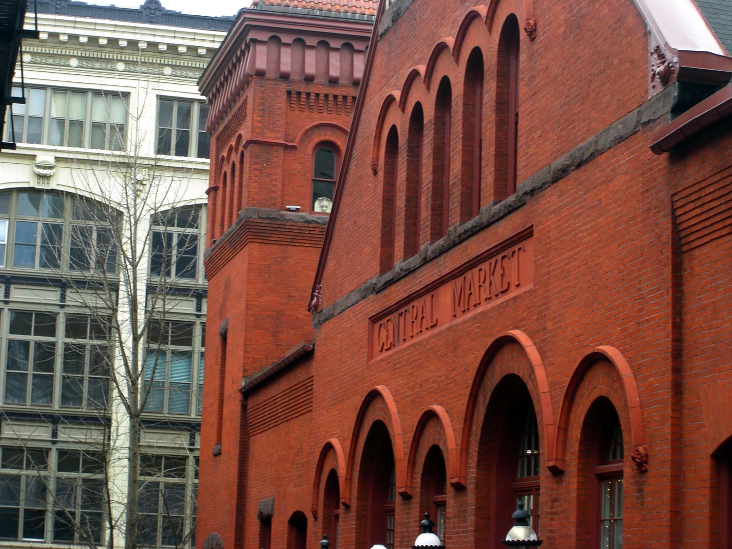 1889 Romanesque Revival brick Central Market house with twin towers at Penn Square in downtown Lancaster, Pennsylvania