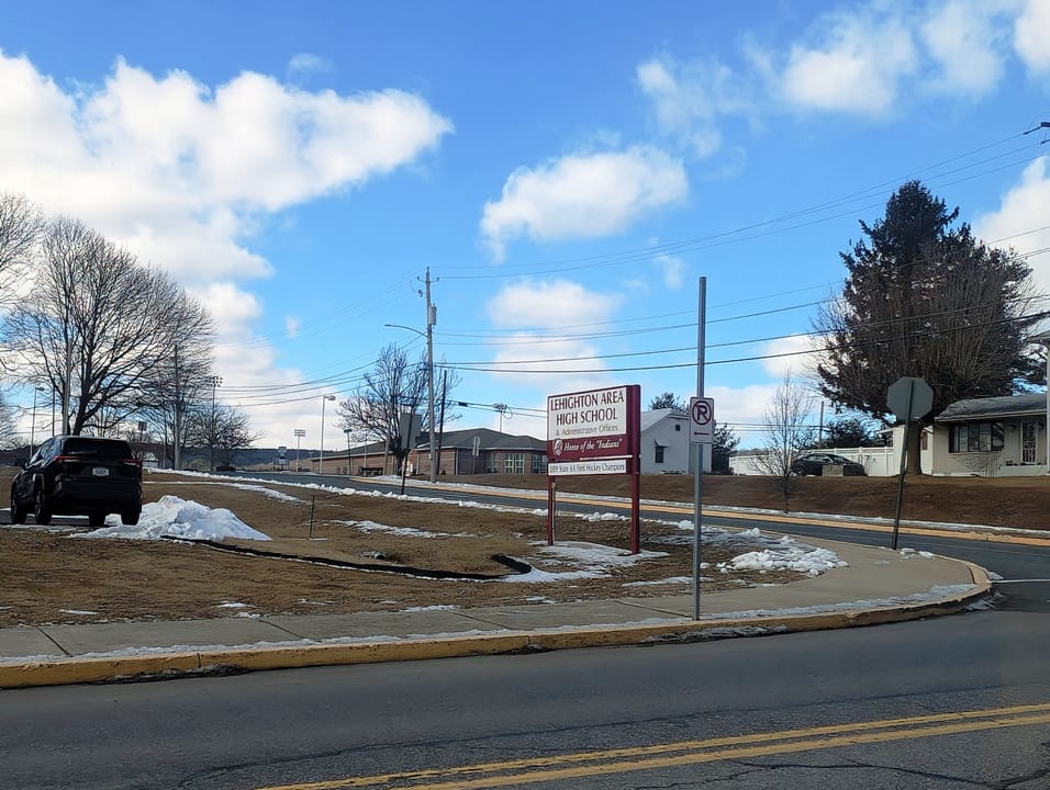 Photo of a sign for the Lehighton Area High School in Lehighton, Pennsylvania. Photo taken from Pennsylvania Route 902 (South 9th Street) looking northwest.