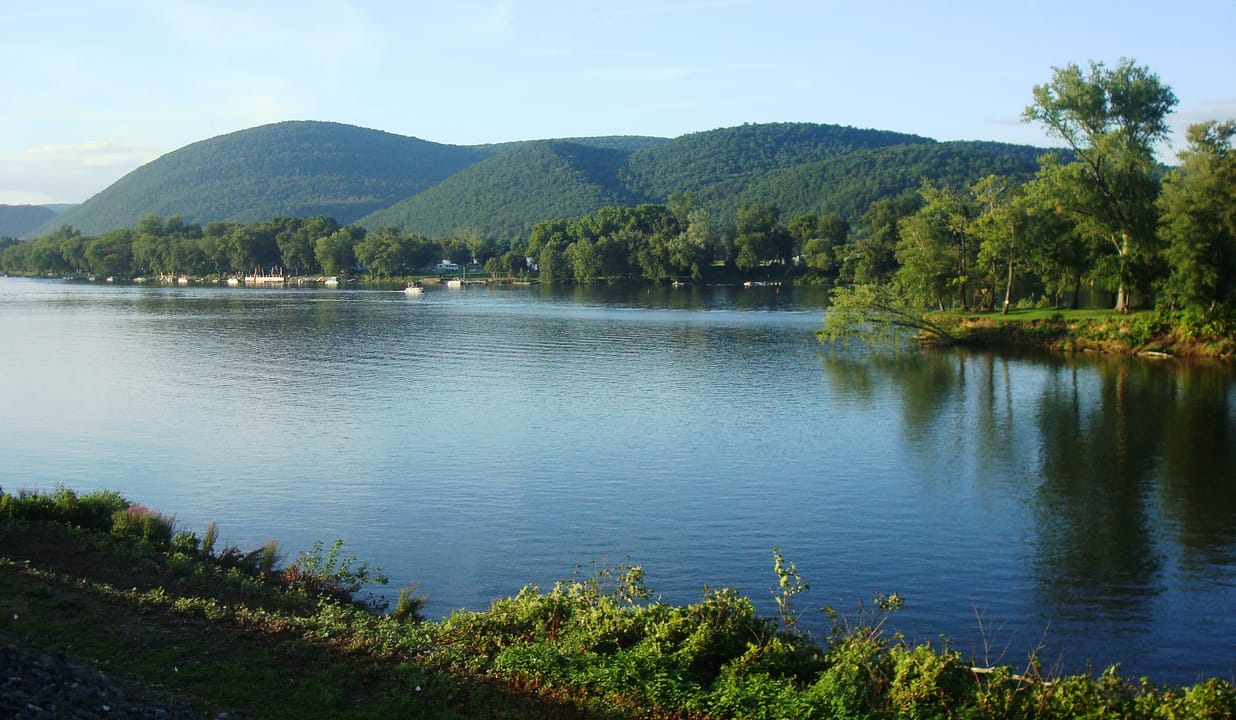 The West Branch Susquehanna River looking north (upstream) from the William Clinger Riverwalk in Lock Haven, Pennsylvania.