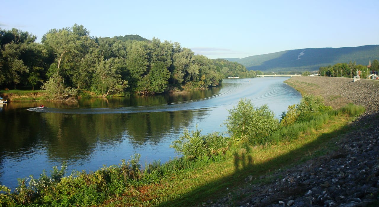 The West Branch Susquehanna River looking east-southeast (downstream) from the William Clinger Riverwalk in Lock Haven, Pennsylvania.