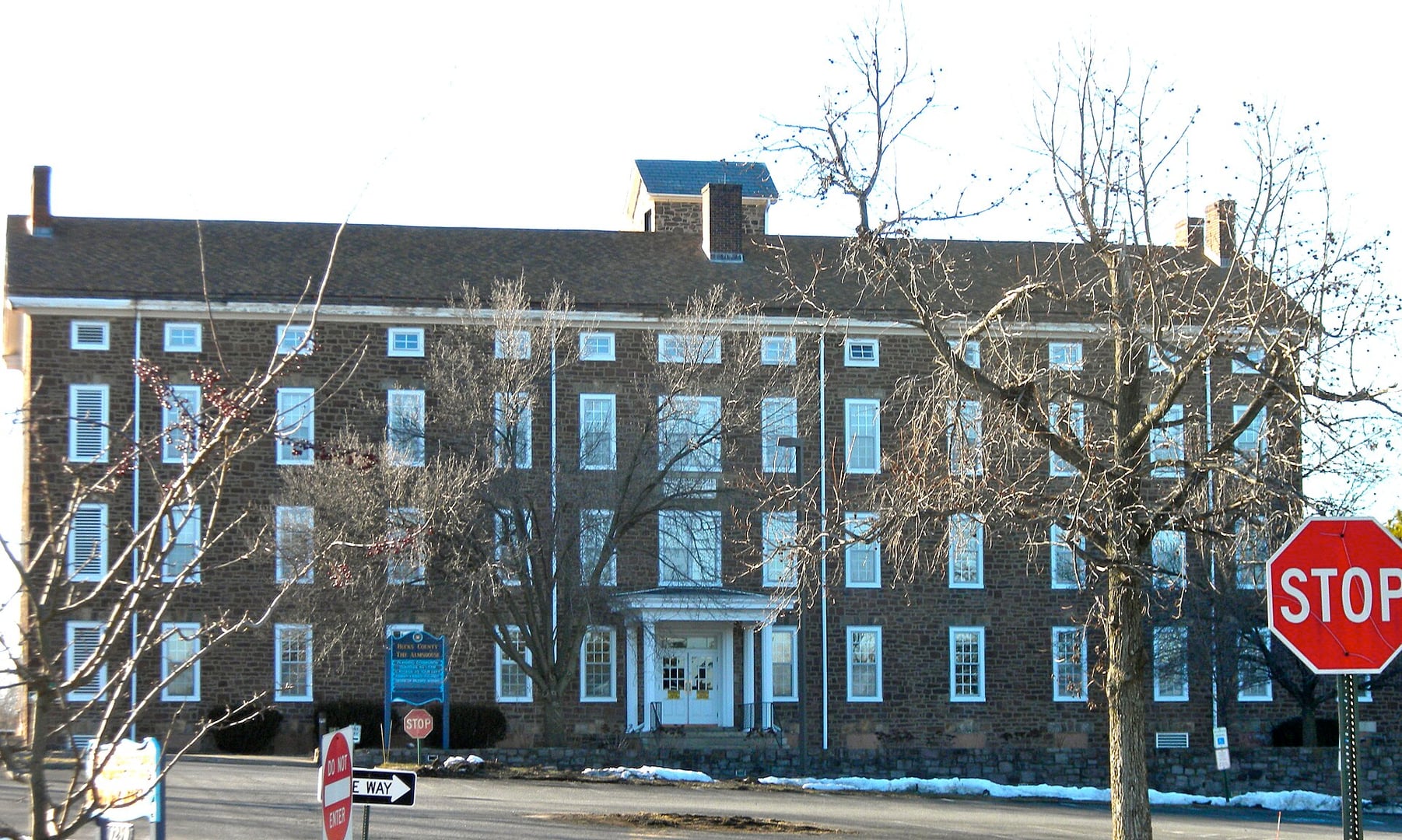 The 1869 Bucks County Hospital building on the almshouse property at Almshouse Road and Route 611 in Doylestown Township, Bucks County Pennsylvania — part of the Neshaminy Manor complex