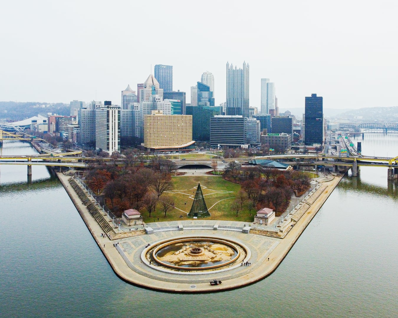 Aerial view of Point State Park at the confluence of Pittsburgh's three rivers, with the iconic fountain visible