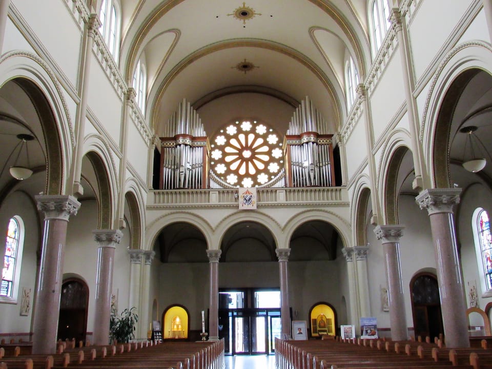 The organ loft and rose window above the entrance of Saint Vincent Basilica, Latrobe, Pennsylvania.