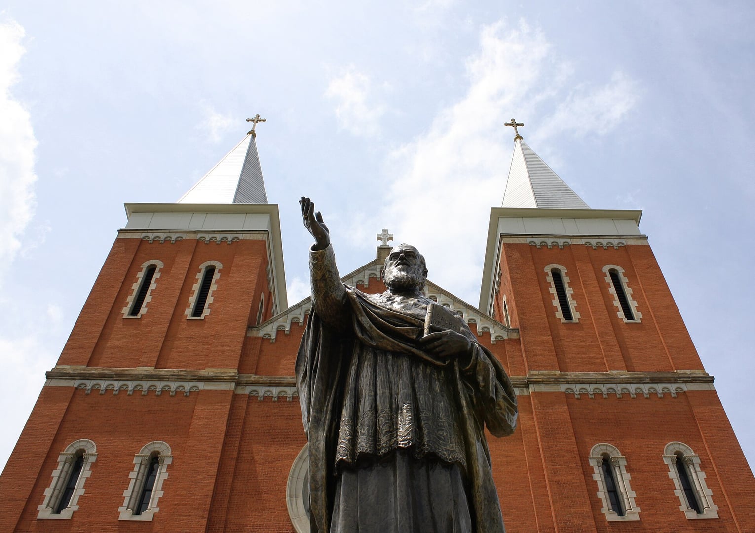 Exterior of Saint Vincent Archabbey Basilica in Latrobe, Pennsylvania, with the statue of founder Archabbot Boniface Wimmer in the foreground