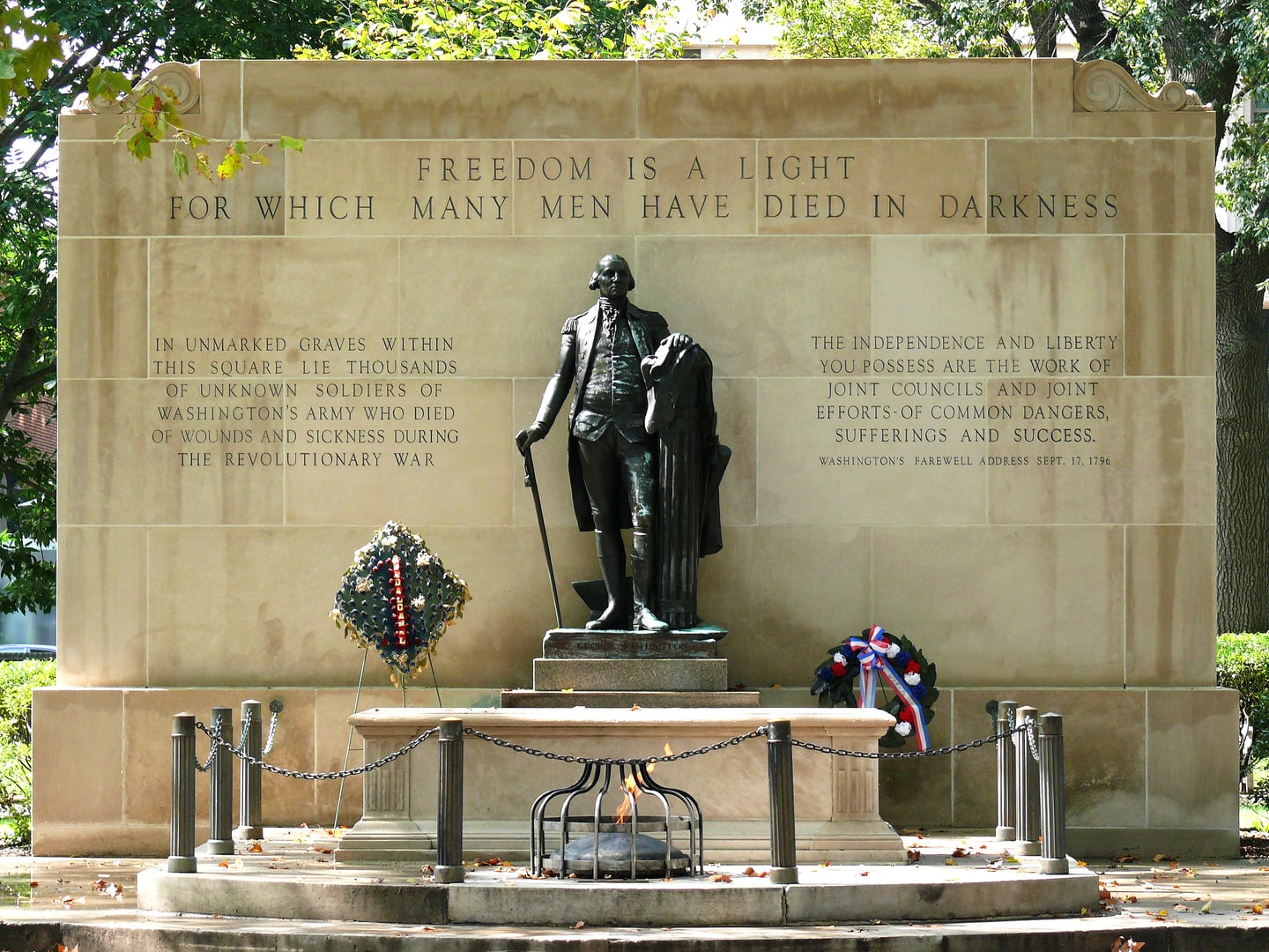 Aerial view of Washington Square with diagonal walkways converging on the Tomb of the Unknown Revolutionary War Soldier in Philadelphia