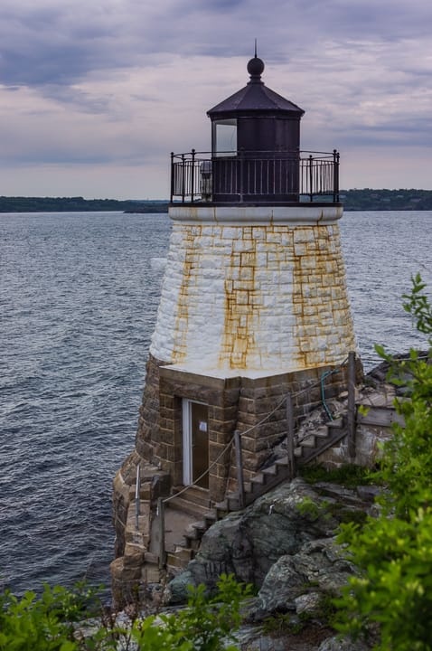 500px provided description: The lighthouse at Castle Hill, Newport, Rhode Island, USA. [#clouds ,#lighthouse ,#ocean]