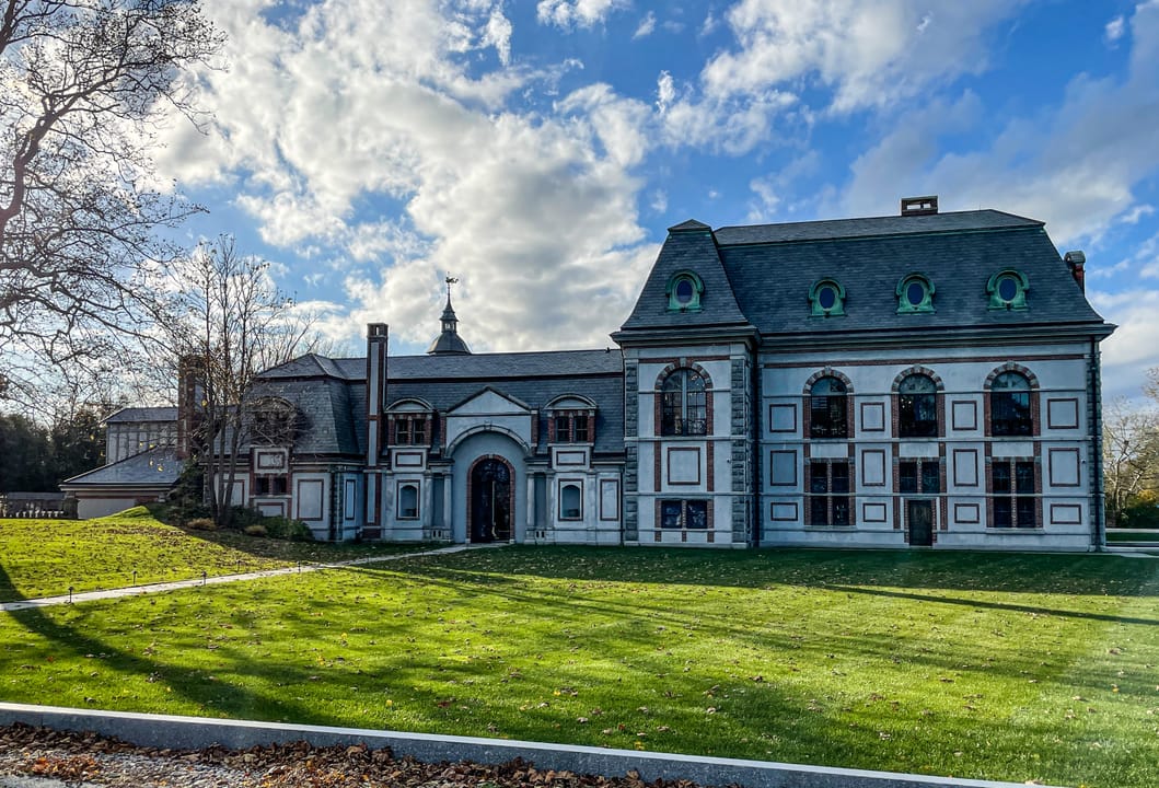 The limestone and granite exterior of Belcourt Castle on Bellevue Avenue in Newport, Rhode Island, a 60-room Gilded Age mansion designed by Richard Morris Hunt and completed in 1895