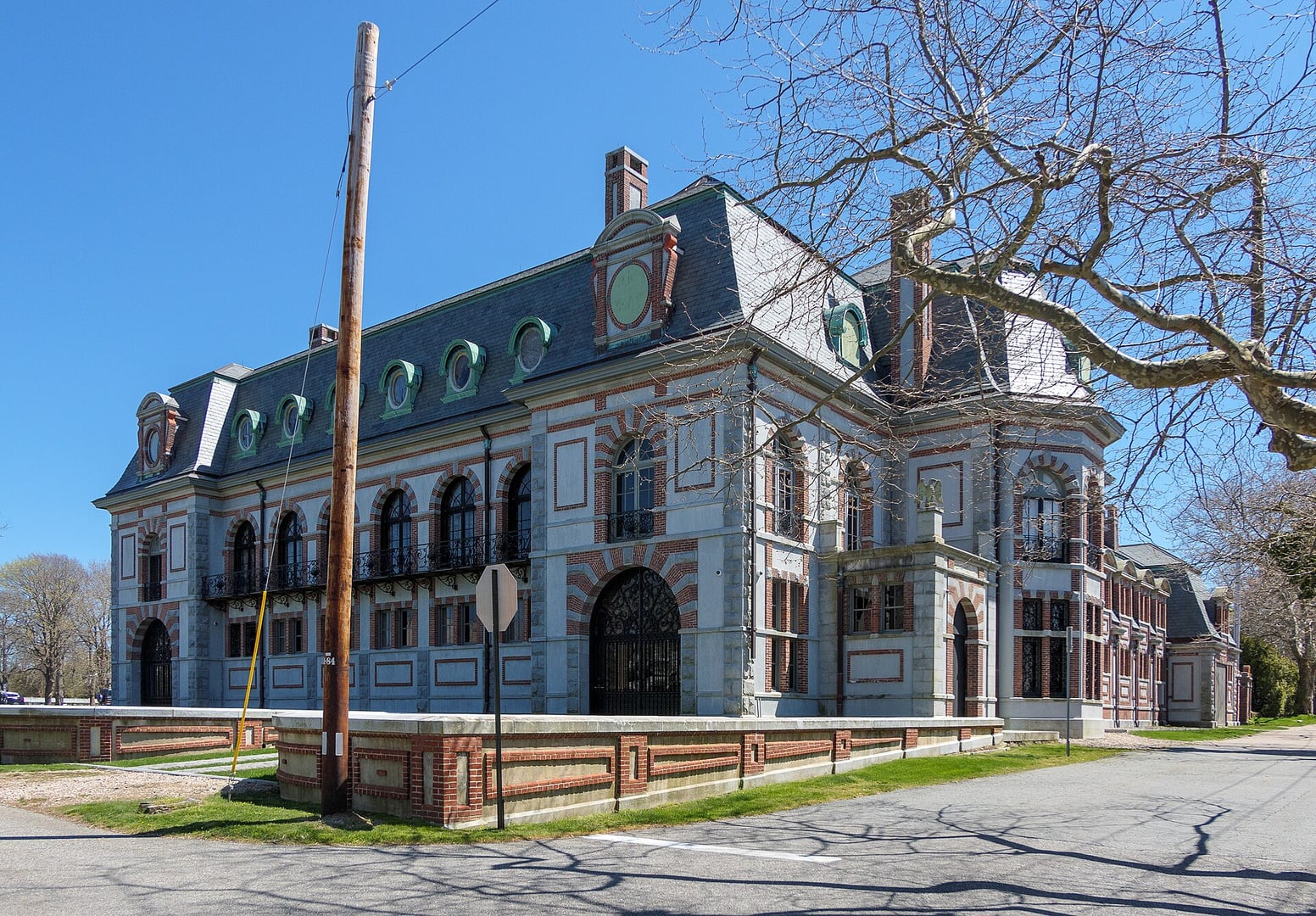 The limestone and granite exterior of Belcourt Castle on Bellevue Avenue in Newport, Rhode Island, a 60-room 1894 Gilded Age mansion designed by Richard Morris Hunt