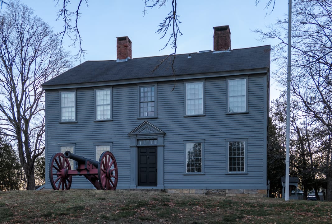 Front exterior of the General Nathanael Greene Homestead, a two-story white clapboard Colonial house on Taft Street in Coventry, Rhode Island