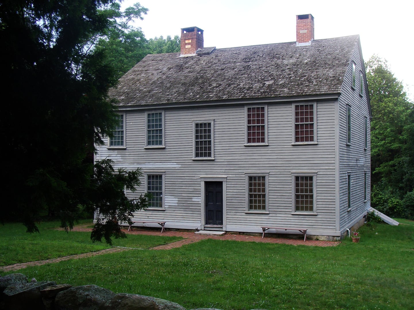 Front exterior of the General Nathanael Greene Homestead, a two-story white clapboard Colonial house on Taft Street in Coventry, Rhode Island
