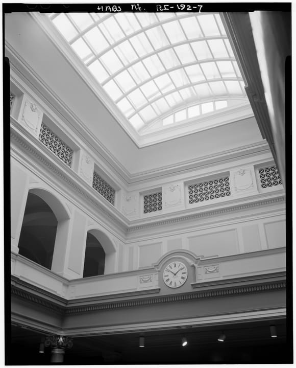 Looking up through Providence City Hall's central stair hall and glass-roofed atrium from the fourth floor; Historic American Buildings Survey documentation (HABS RI,4-PROV,92-7).