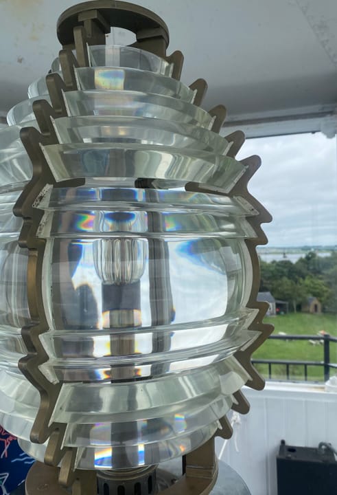 The Fresnel lens in the Rose Island Light lantern room, which is accessible to visitors.