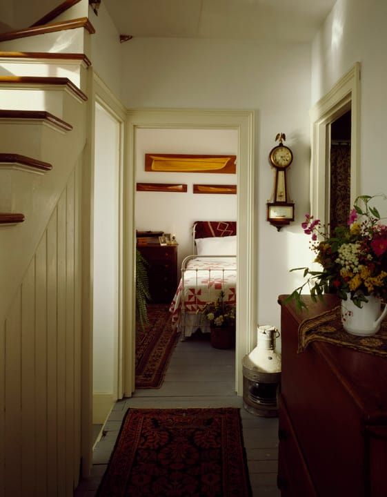 A hallway in the keeper's quarters at Rose Island Lighthouse, now run as a museum and overnight hostel, leading toward a guest bedroom.