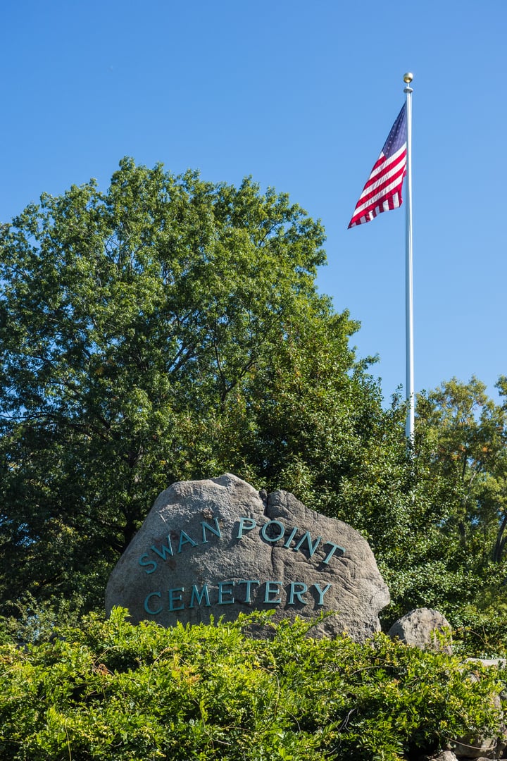 Stone entrance gate to Swan Point Cemetery, a 200-acre garden cemetery established 1846 along the Seekonk River in Providence, Rhode Island