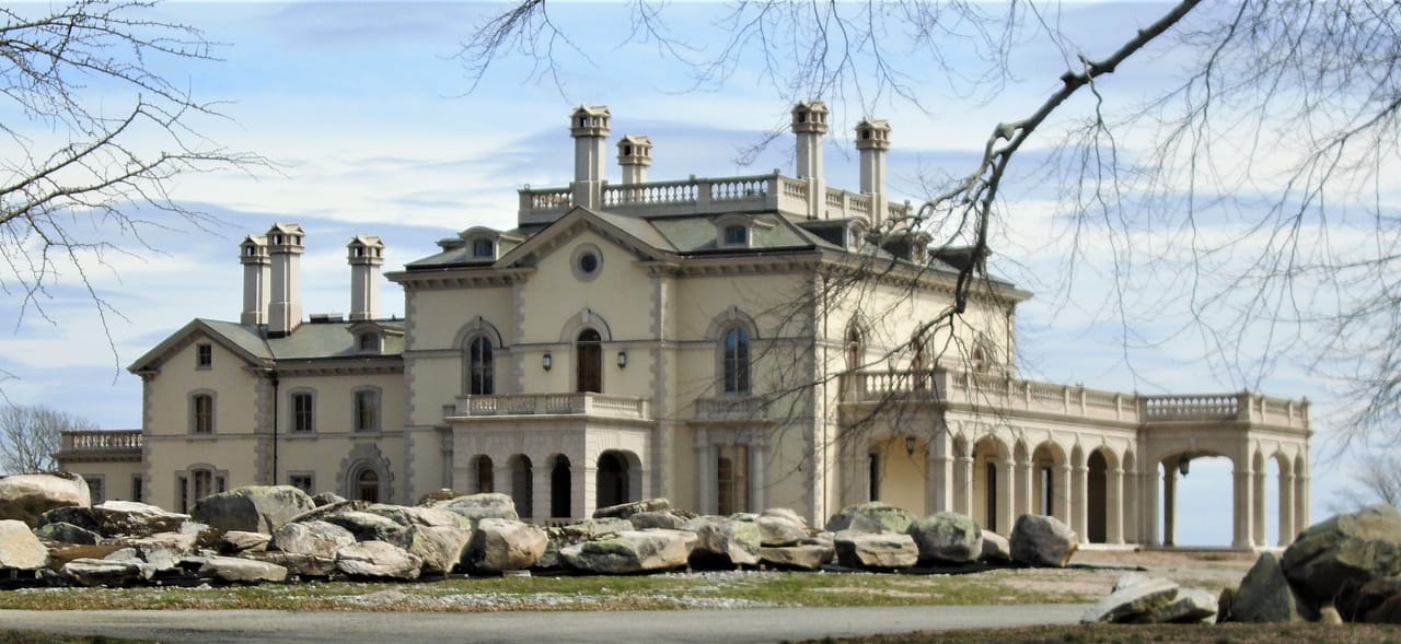 Italianate facade and driveway approach of Beechwood, the Astor family's Gilded Age cottage at 580 Bellevue Avenue in Newport, Rhode Island