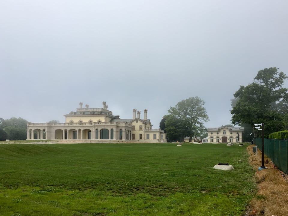 Wide view of Beechwood and its grounds from across the lawn, Newport, Rhode Island, July 2017, hazy morning light.