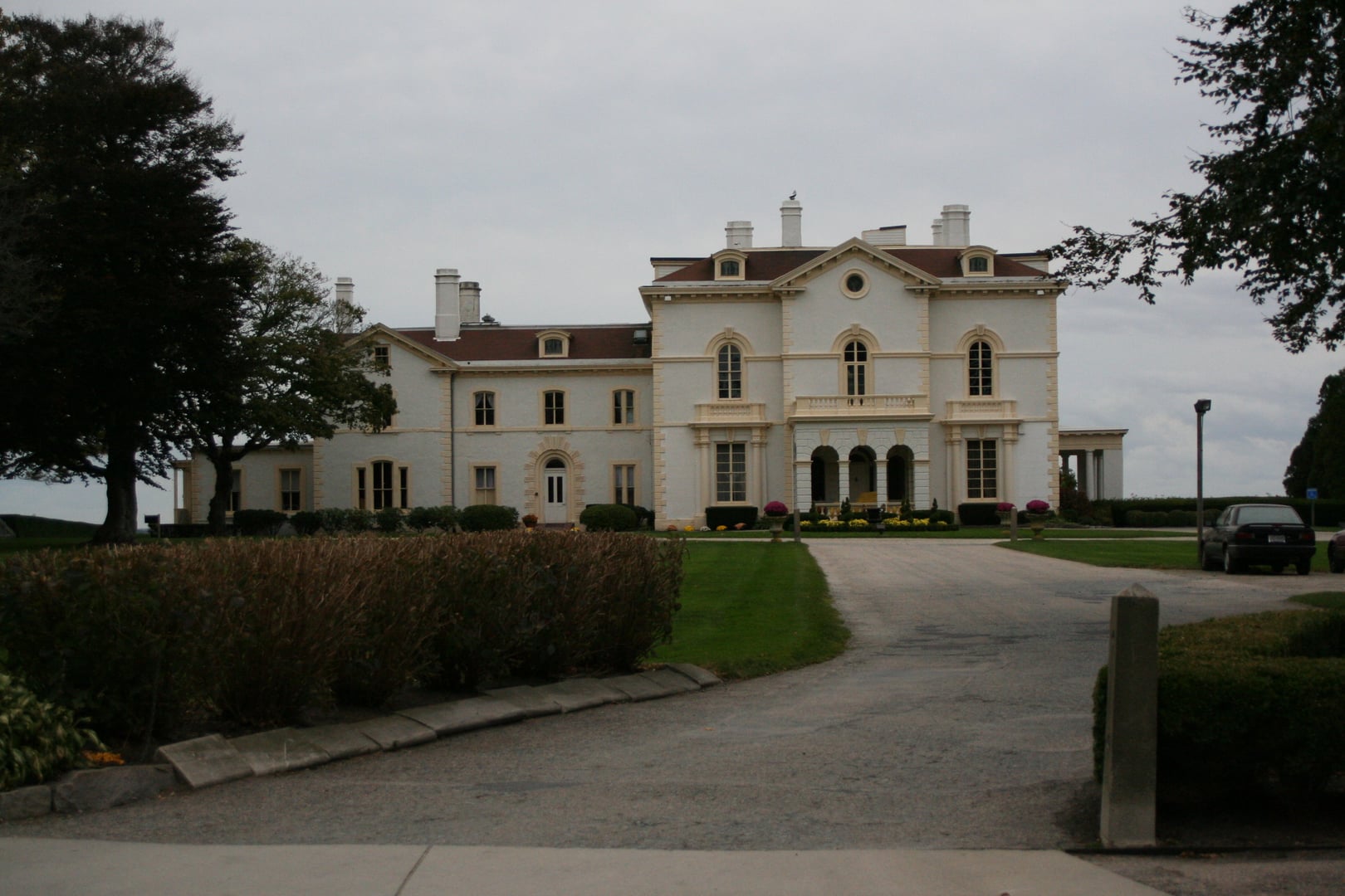 Italianate facade and driveway approach of Beechwood, the Astor family's Gilded Age cottage at 580 Bellevue Avenue in Newport, Rhode Island