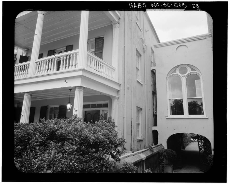 The piazza columns and side elevation of the Stevens-Lathers House (20 South Battery / Battery Carriage House Inn), Charleston, South Carolina.