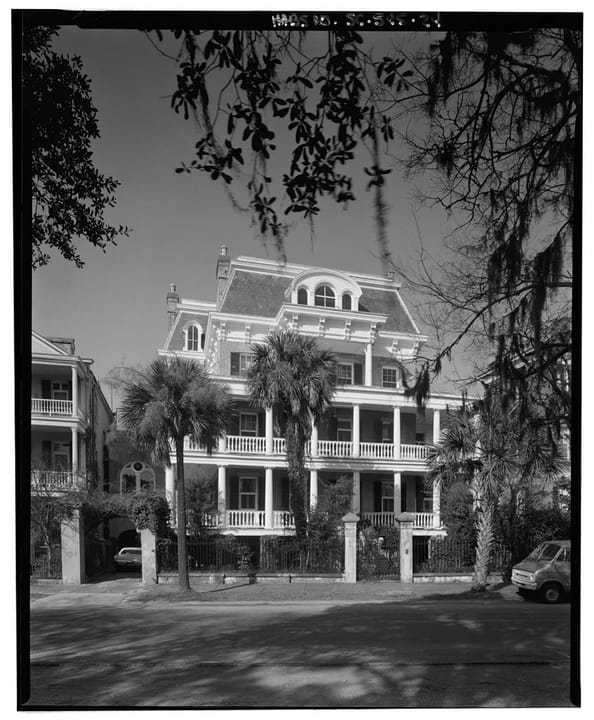 The Stevens-Lathers House (20 South Battery / Battery Carriage House Inn), Charleston, South Carolina, viewed from the street beneath Spanish-moss-draped oaks.