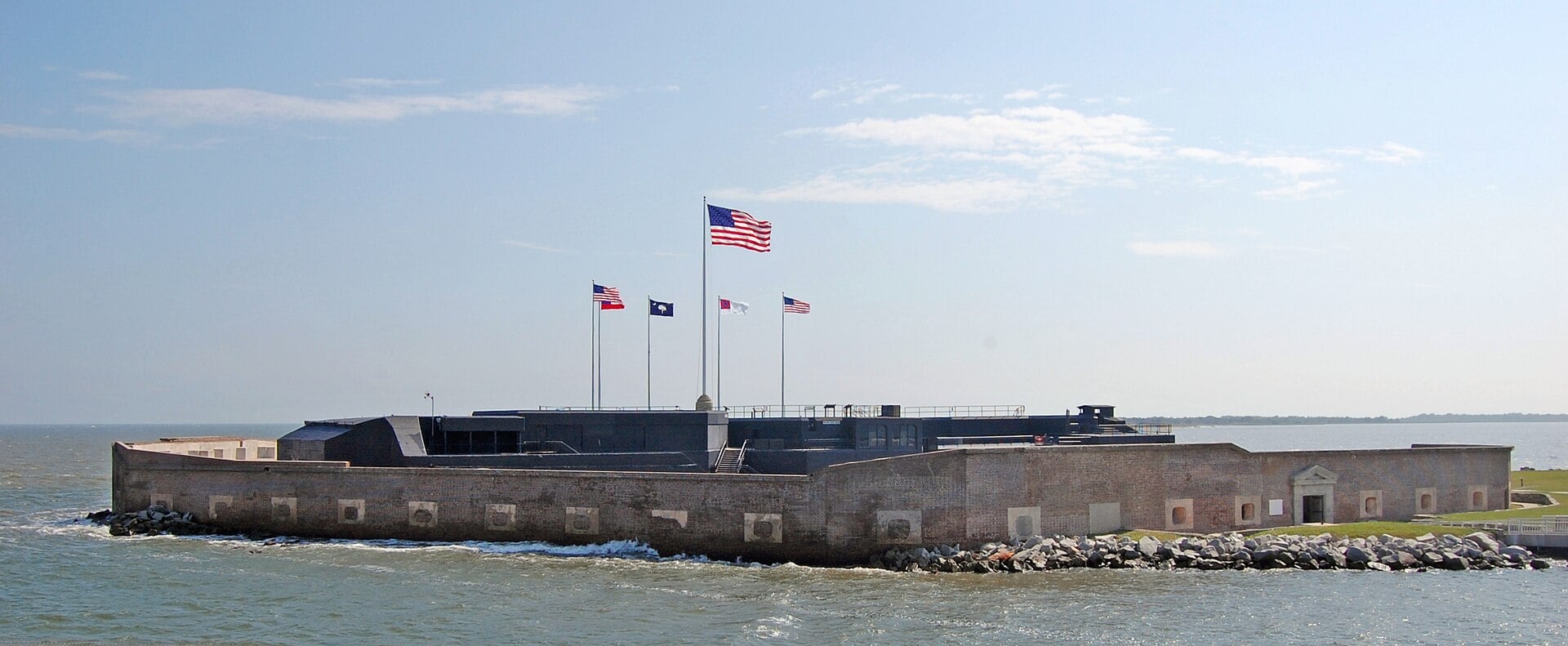 Fort Sumter, the brick island fort in Charleston Harbor where the Civil War began on April 12, 1861, U.S. flag flying over the gun emplacements
