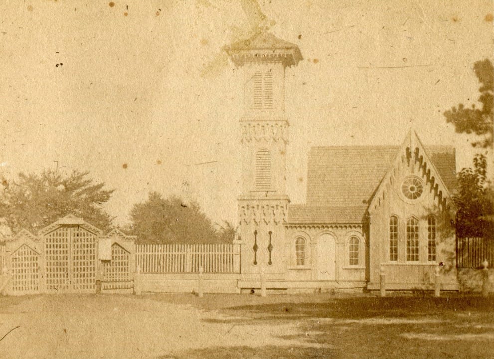 The original Porter's Lodge (gatehouse) at Magnolia Cemetery, designed by Edward C. Jones, built 1850 and demolished in 1868 after Civil War damage; photographed circa 1865.
