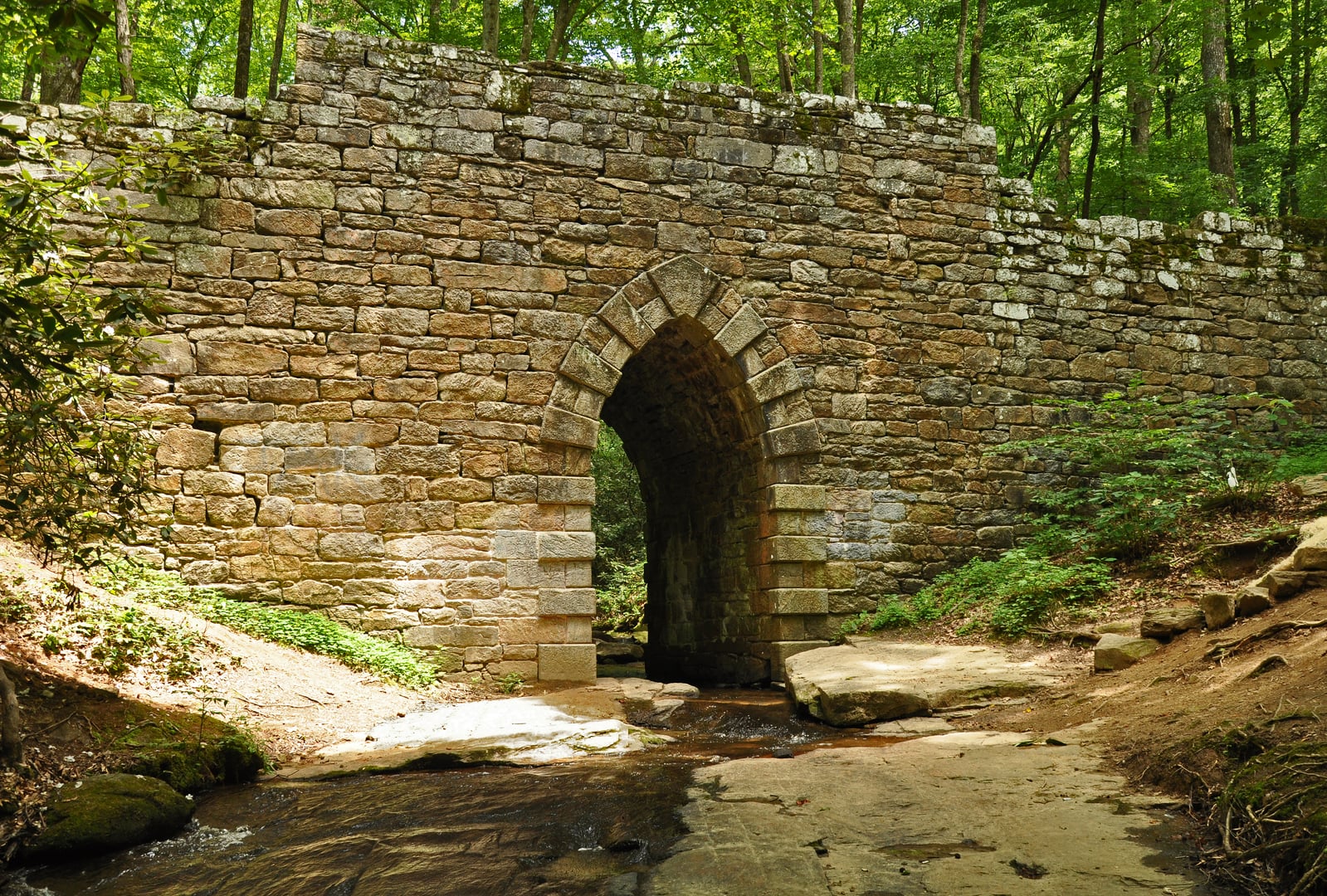 Gothic stone arch of Poinsett Bridge over Little Gap Creek in Greenville County SC