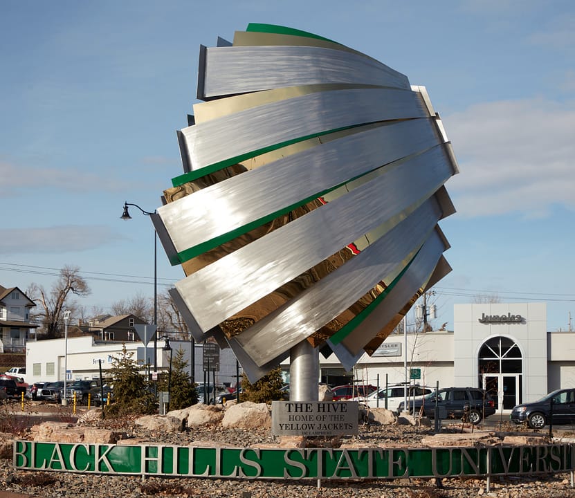 "The Hive, Home of the Yellow Jackets," a 20-foot sculpture by Dale Claude Lamphere at the Black Hills State University entrance roundabout, Spearfish, South Dakota (2021, Carol M. Highsmith).