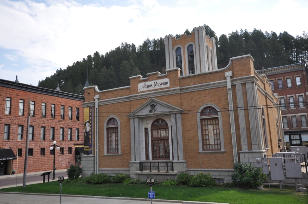 The 1892 Queen Anne Adams House mansion in Deadwood, South Dakota, with corner tower and spindlework