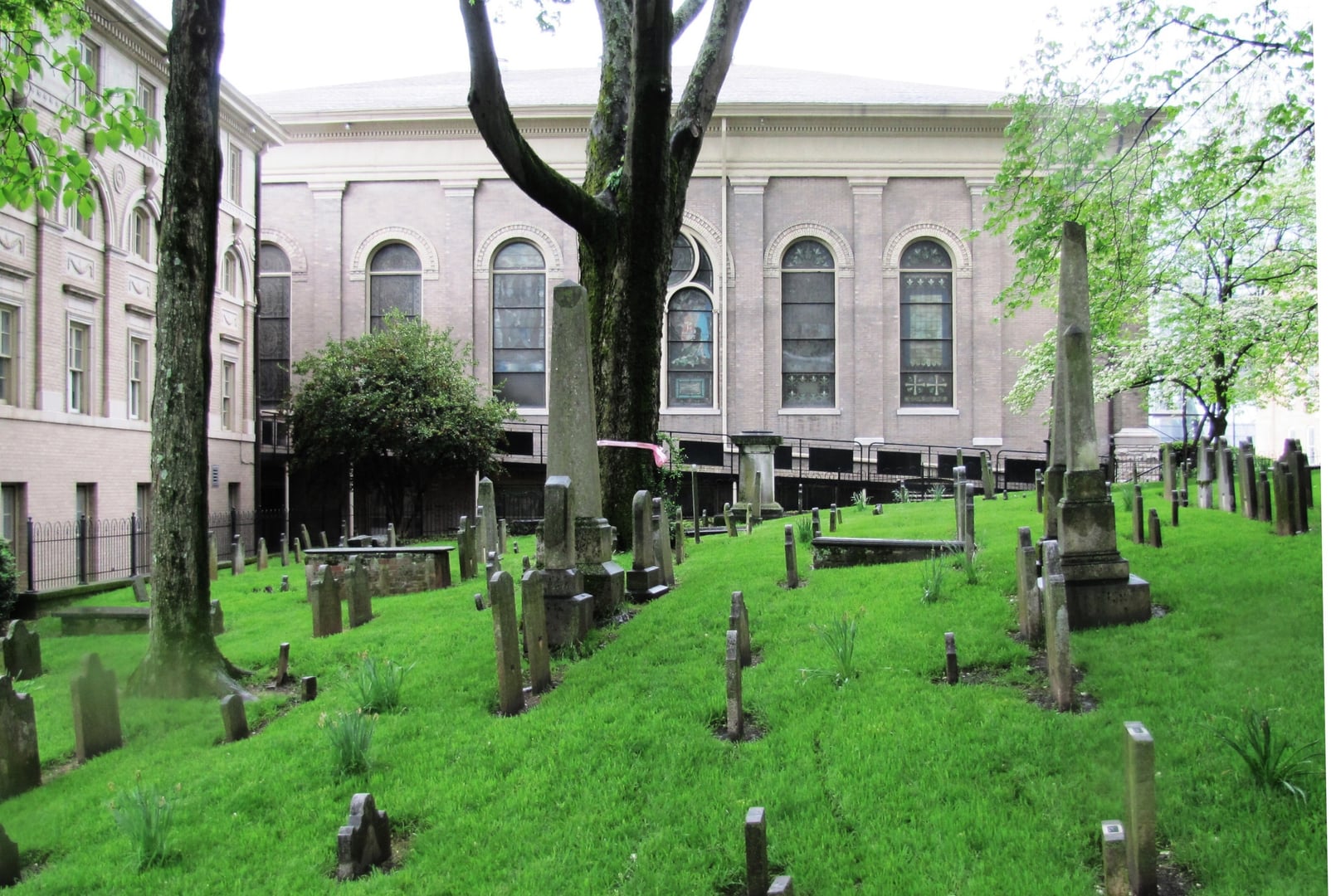 Oldest graveyard in Knoxville (platted 1795), looking south at the First Presbyterian Church behind weathered headstones.